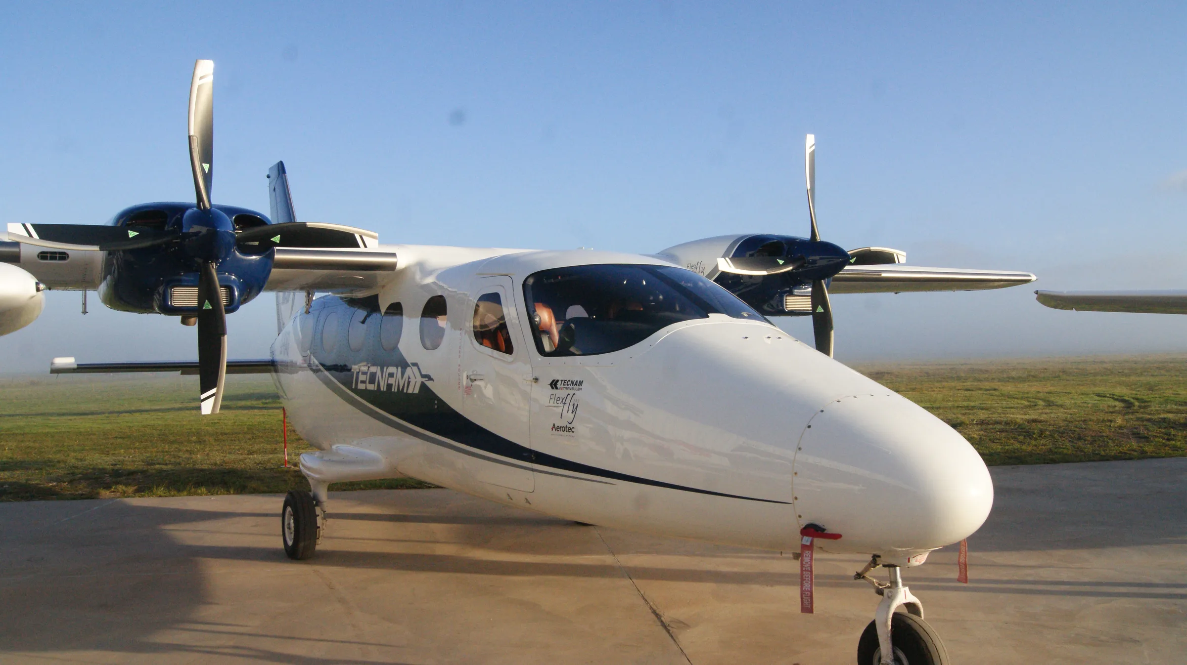 Side view of the twin-engine aircraft on the apron