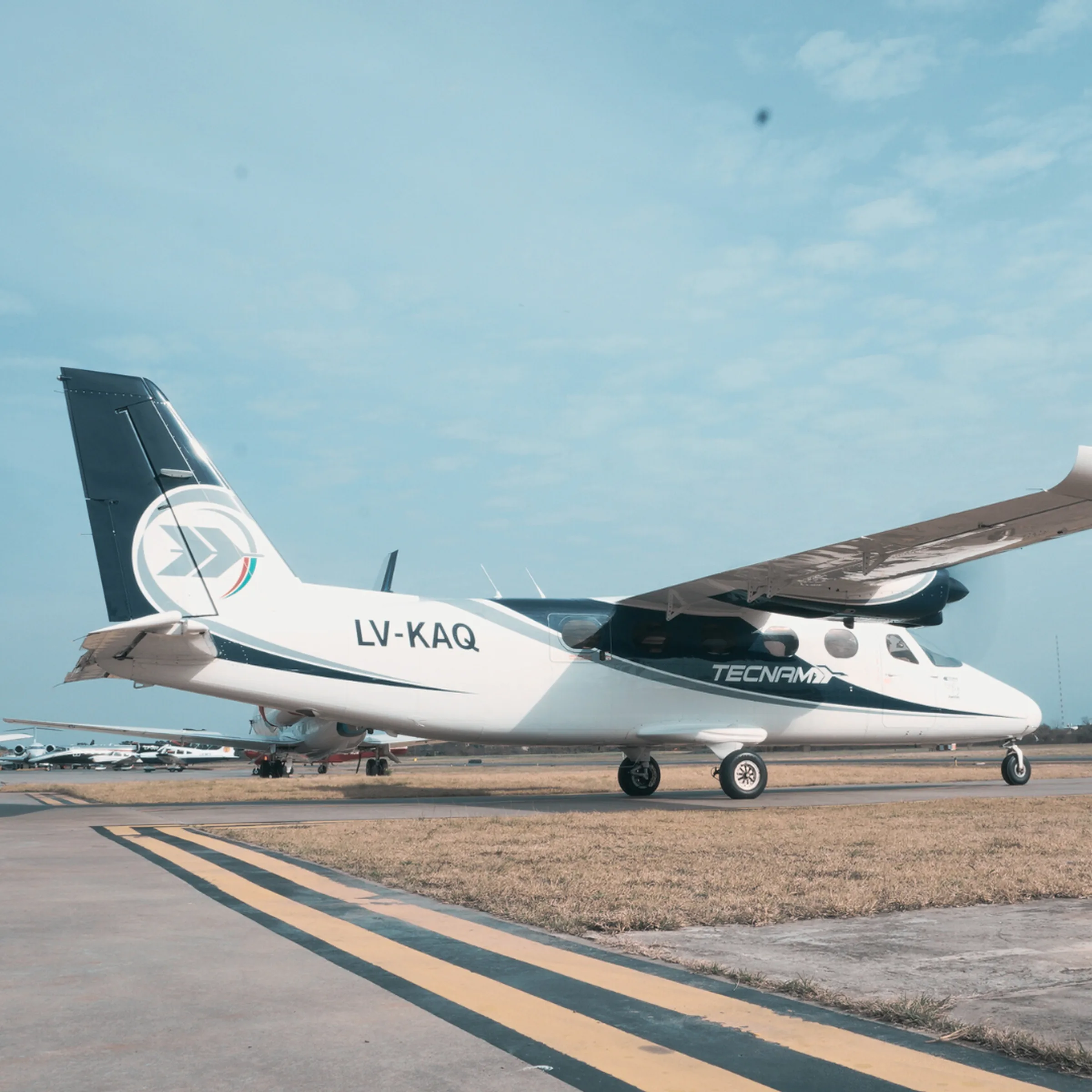 Twin-engine aircraft taxiing towards the runway threshold